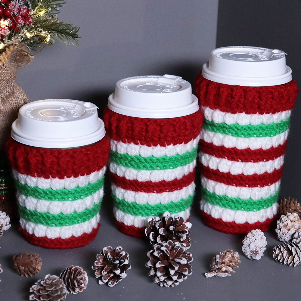 Crocheted coffee cup cozies, hooked on clusters cup cozies. 