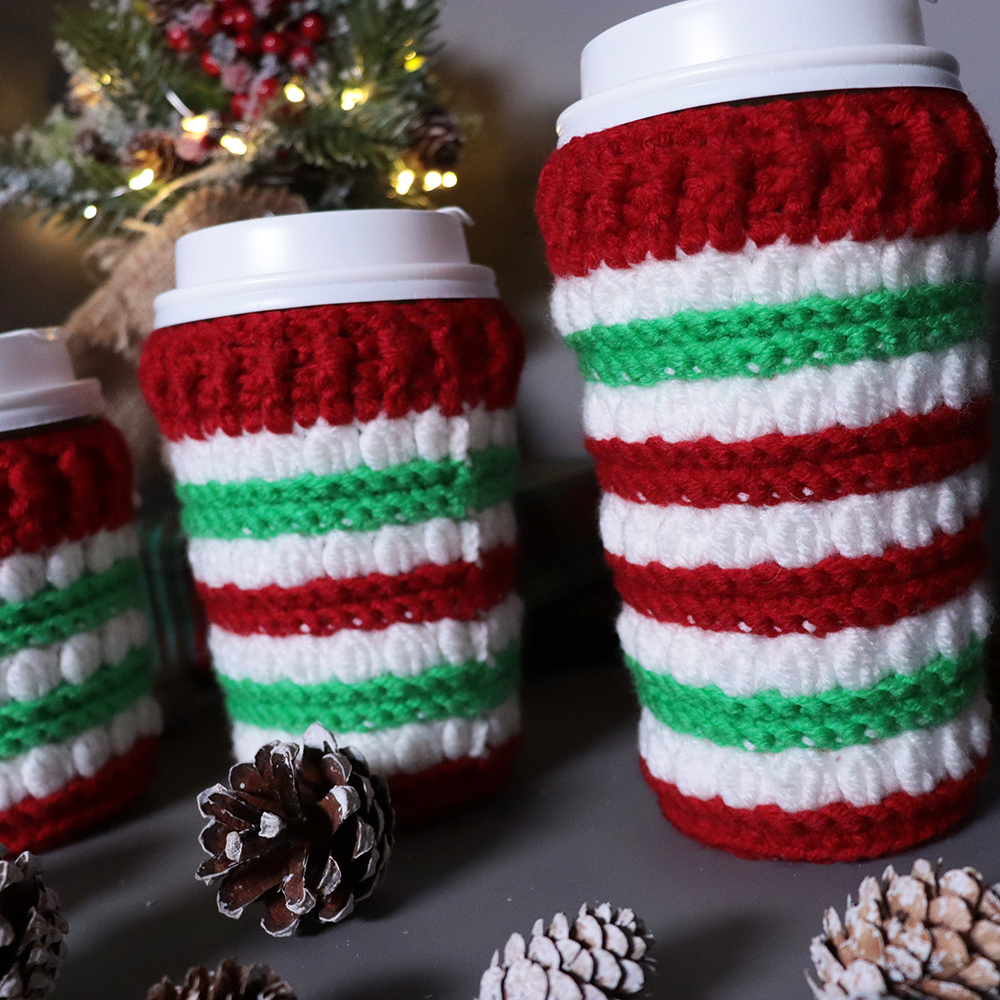 Crocheted coffee cup cozies, hooked on clusters cup cozies.