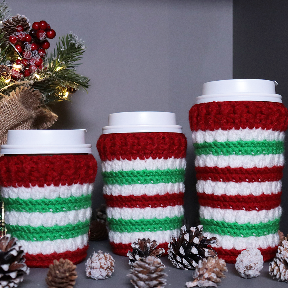 Crocheted coffee cup cozies, hooked on clusters cup cozies.